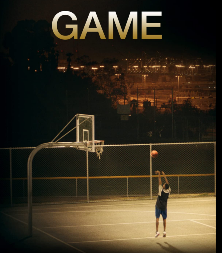 A lone basketball player makes a shot at the local court at night. Film title above image: GAME - Director: Jeannie Donohoe
